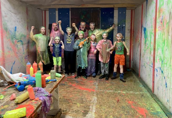 Young group in spatter room at Hidden Key Escape Room